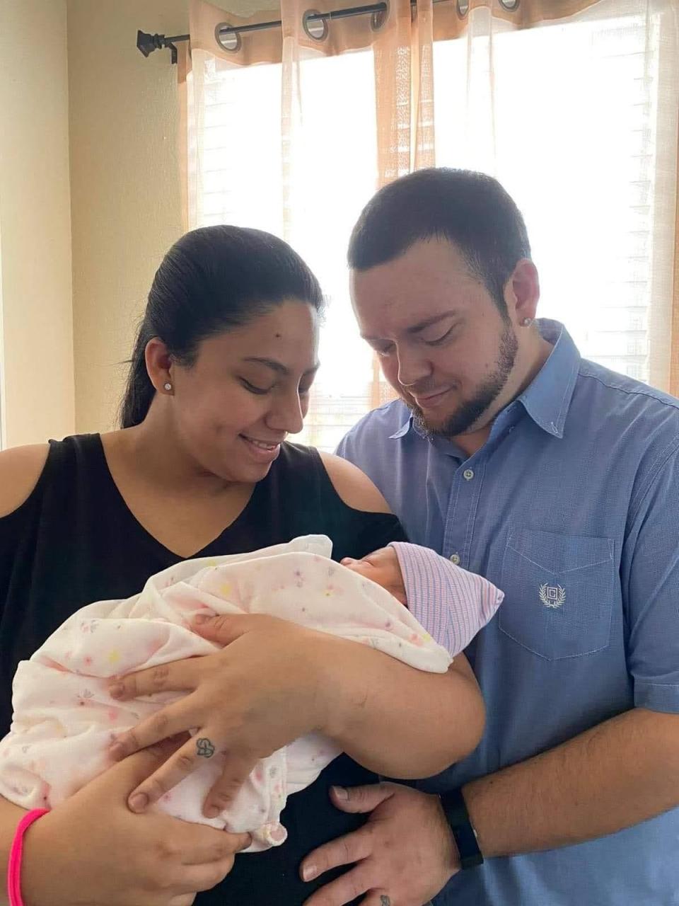 Jeremy and Sauhry Turner with their newest baby, Juliet. The Turner family has three girls all born on Sept. 3 within four years.