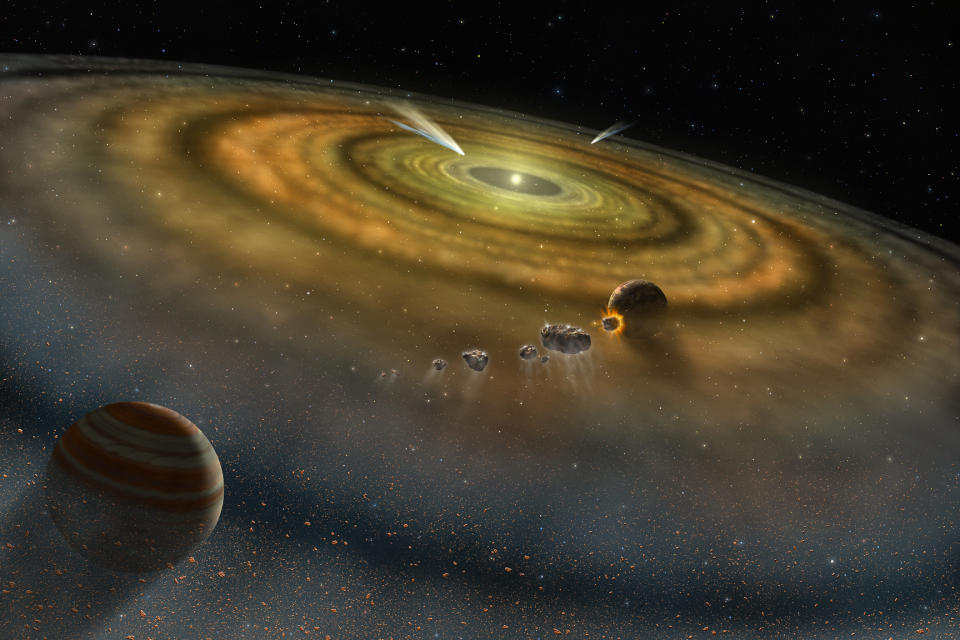 A few planets growing in a planet-forming disk around a glowing star.