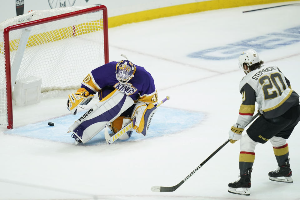 Vegas Golden Knights center Chandler Stephenson (20) scores a goal against Los Angeles Kings goaltender Calvin Petersen (40) during the second period of an NHL hockey game Wednesday, April 14, 2021, in Los Angeles. (AP Photo/Ashley Landis)