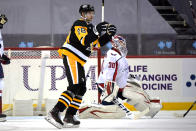 Pittsburgh Penguins' Marcus Pettersson (28) celebrates his goal against Washington Capitals goaltender Ilya Samsonov (30) during the second period of an NHL hockey game in Pittsburgh, Sunday, Jan. 17, 2021. (AP Photo/Gene J. Puskar)