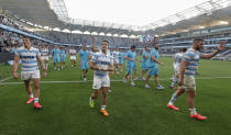 Argentina players wave to the crowd as they celebrate after the Tri-Nations rugby test between Argentina and New Zealand at Bankwest Stadium, Sydney, Australia, Saturday, Nov.14, 2020. Argentina defeated the All Blacks 25-15. (AP Photo/Rick Rycroft)