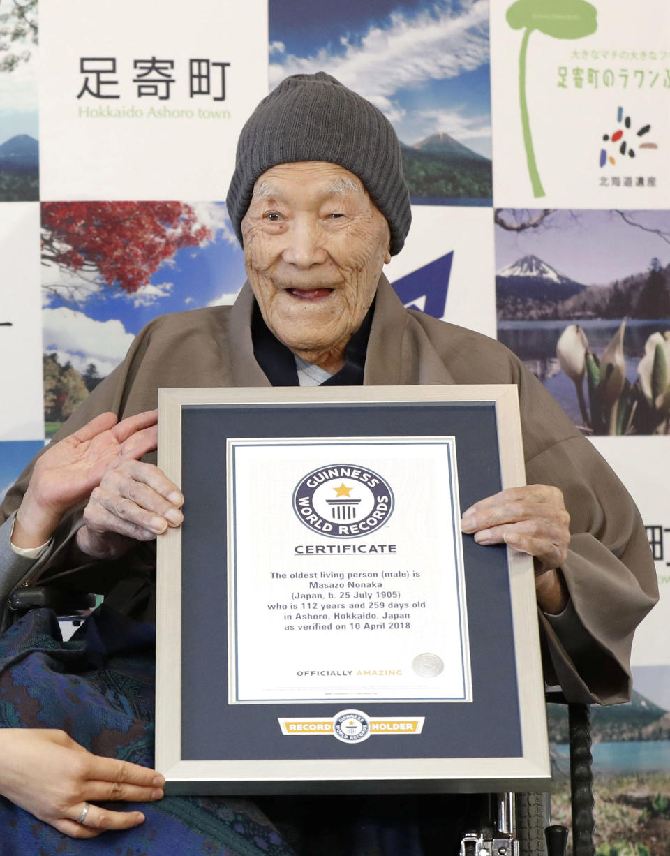 Masazo Nonaka, who was born 112 years and 259 days ago, receives a Guinness World Records certificate naming him the world's oldest man during a ceremony in Ashoro, on Japan's northern island of Hokkaido, on Tuesday. (Photo: Kyodo via Reuters)