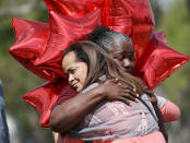 <p>Kay Blake (L) hugs school bus driver Pearlie Corker as they visit in front of Marjory Stoneman Douglas High School as teachers and staff are allowed to return to the school for the first time since the mass shooting on campus on February 23, 2018 in Parkland, Fla. (Photo: Joe Raedle/Getty Images) </p>