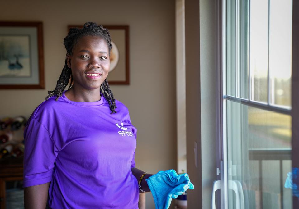 Lilian Okech stands for a photo while cleaning a unit at the Vintage Cooperative of Altoona, Wednesday, Dec. 7, 2022.