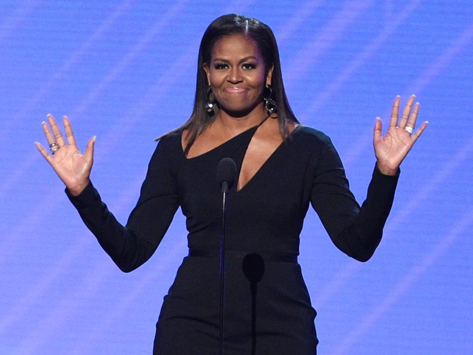 michelle obama presenting an award