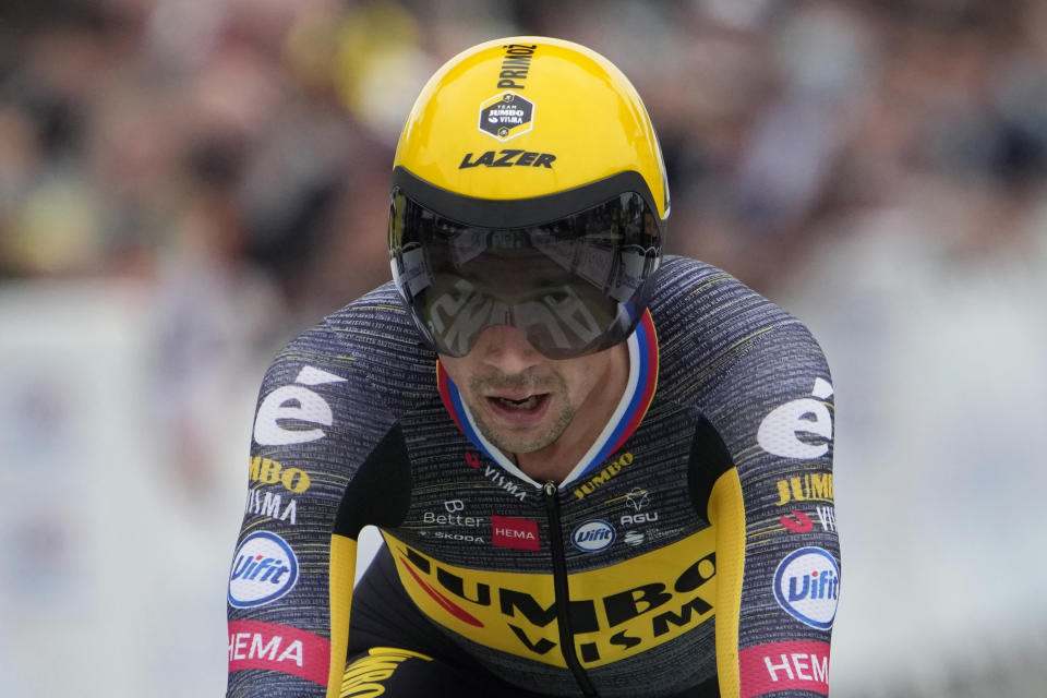 Slovenia's Primoz Roglic crosses the finish line of the fifth stage of the Tour de France cycling race, an individual time-trial over 27.2 kilometers (16.9 miles) with start in Change and finish in Laval Espace Mayenne, France, Wednesday, June 30, 2021. (AP Photo/Christophe Ena, Pool)