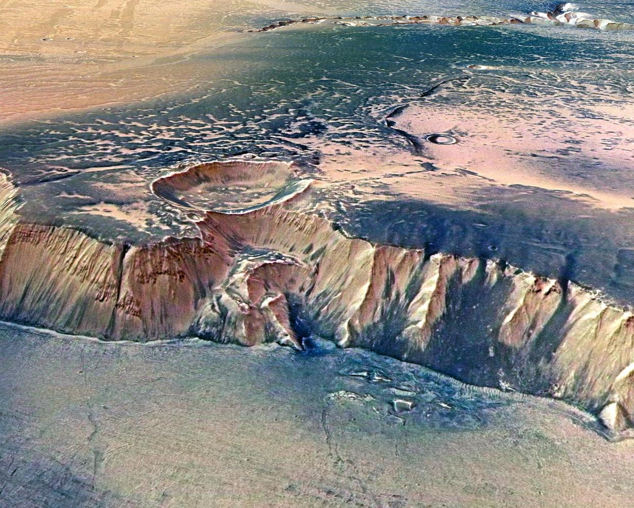 In this handout image supplied by the European Space Agency (ESA) on July 16, 2008, the Echus Chasma, one of the largest water source regions on Mars, is pictured from ESA's Mars Express: Getty Images