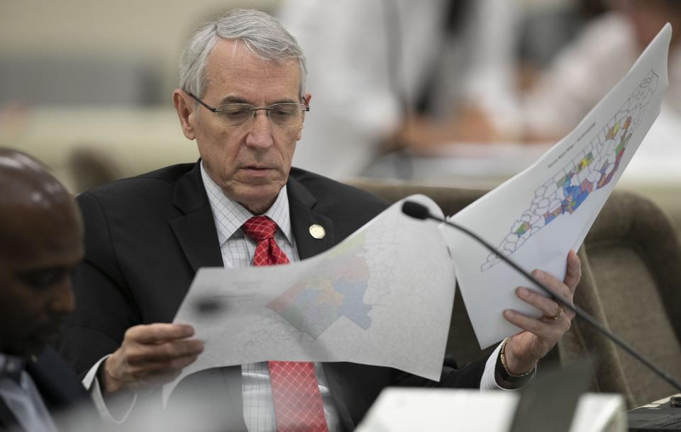 FILE - In this Sept. 12, 2019, file photo, Rep. John Szoka, R-Fayetteville, looks over a redistricting map during a committee meeting at the Legislative Office Building in Raleigh, N.C. Republican wins in state legislatures in 2010 put them in a commanding position to draw legislative and congressional maps the following year that essentially cemented their political power for a decade. (Robert Willett/The News & Observer via AP, File)