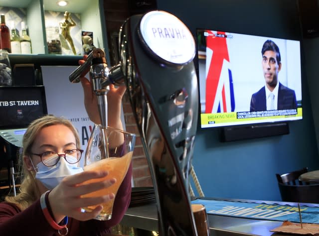 An employee pulls a pint in the Tib Street Tavern in Manchester, as Chancellor of the Exchequer Rishi Sunak announces the government will pay two thirds of the wages of staff in pubs, restaurants and other businesses if they are forced to close under new coronavirus restrictions. Cities in northern England and other areas suffering a surge in Covid-19 cases may have pubs and restaurants temporarily closed to combat the spread of the virus