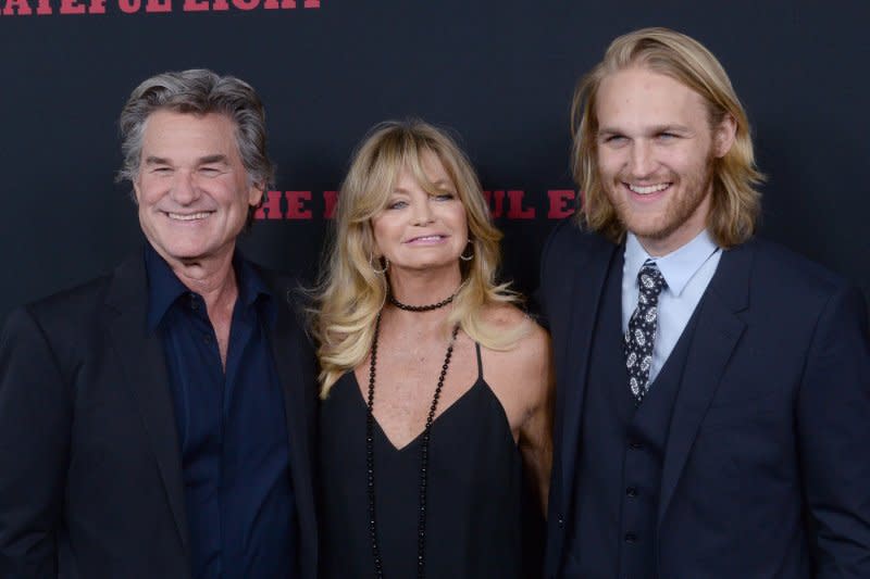 Kurt Russell (L) and his wife, actress Goldie Hawn and their son, actor Wyatt Russell attend the premiere of "The Hateful Eight" at the ArcLight Cinerama Dome in Hollywood in 2015. File Photo by Jim Ruymen/UPI