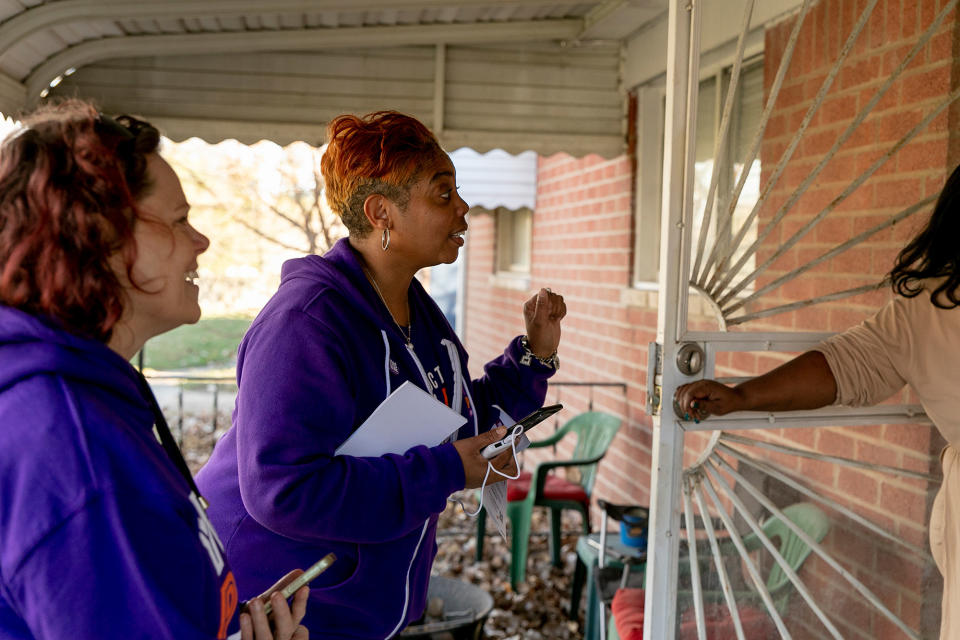 Chanel Cash (center) and Kelly Petrie (left) canvas for Proposal 3 on Nov. 7 in Taylor, Michigan.