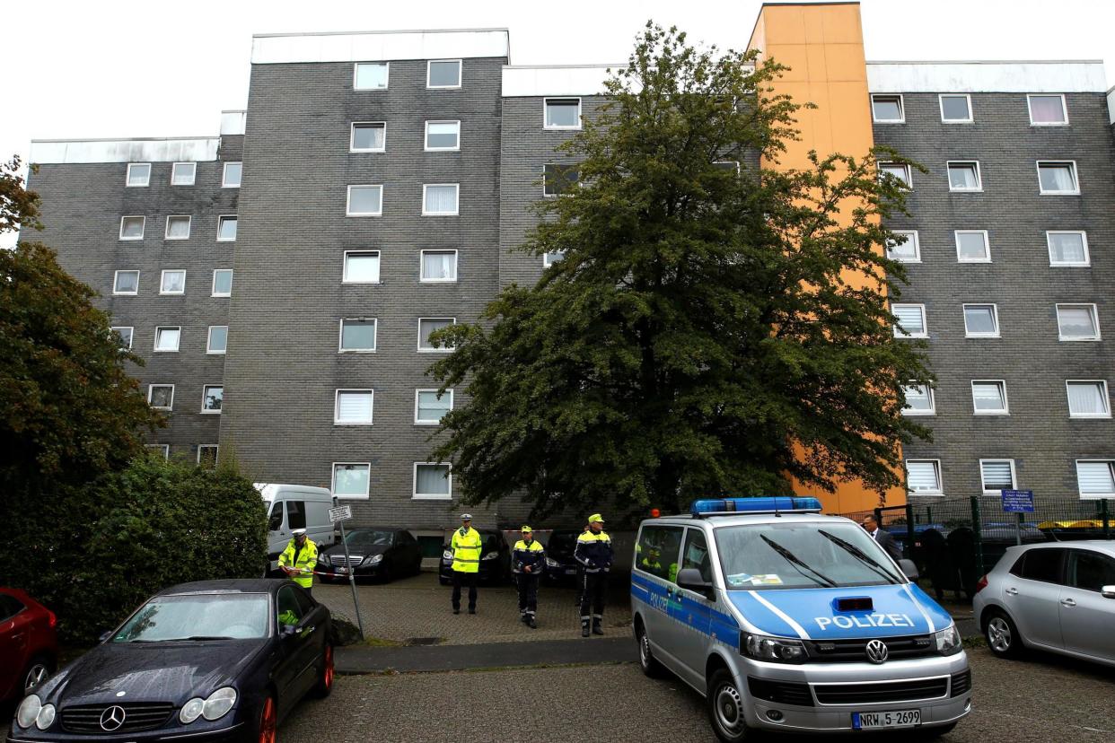 Police officers are seen in front of a residential building where the bodies of five children were found in the western town of Solingen: REUTERS