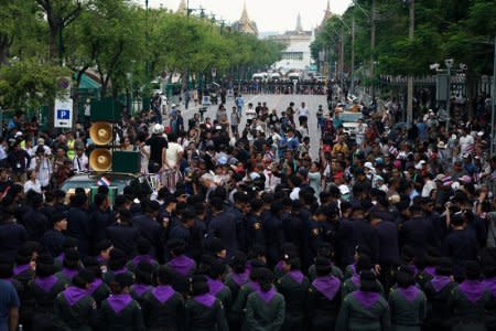 Police officers stand guard during a protest to demand that the military government hold a general election by November, in Bangkok, Thailand, May 22, 2018. REUTERS/Athit Perawongmetha