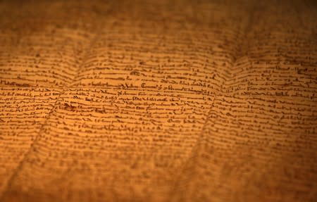 FILE PHOTO: One of the few surviving copies of Magna Carta, Latin for "The Great Charter" written in 1217 on sheep skin is displayed at an exhibition in Hong Kong