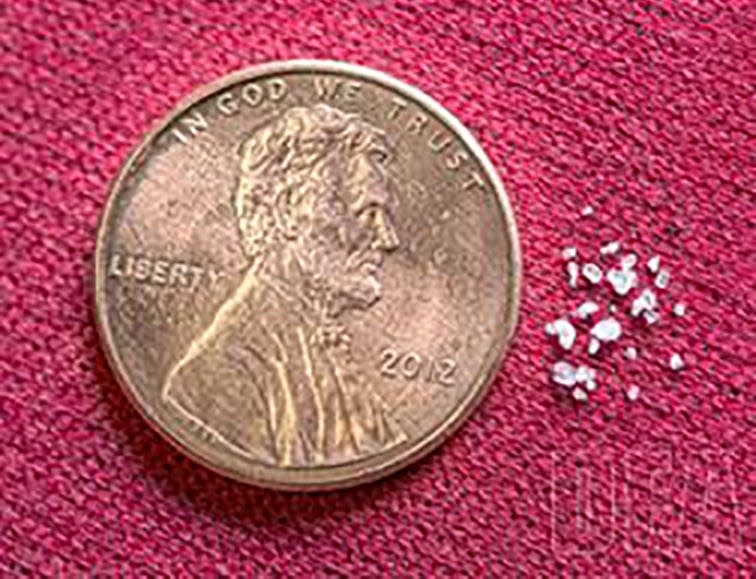 The flakes of fentanyl on the right amount to a lethal dose, according to the U.S. Drug Enforcement Administration.