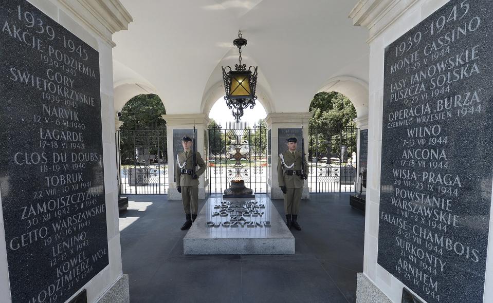 Polish soldiers stand guard at the Tomb of the Unknown Soldier at Pilsudski Square in Warsaw, Poland, Tuesday, Aug. 27, 2019. The square will be the site of commemorations Sunday marking the 80th anniversary of the start of World War II, to be attended by over 40 world leaders, including President Donald Trump. (AP Photo/Czarek Sokolowski)