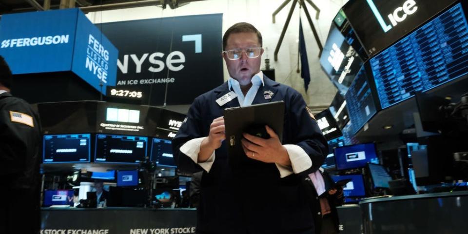 Traders work on the floor of the New York Stock Exchange (NYSE)