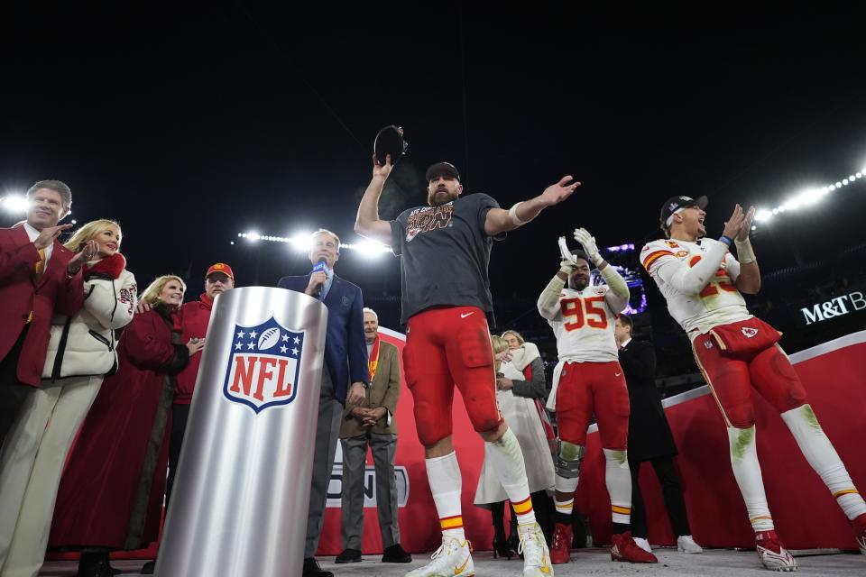 Kansas City Chiefs tight end Travis Kelce (87) holds the Lamar Hunt trophy after the AFC Championship NFL football game against the Baltimore Ravens, Sunday, Jan. 28, 2024, in Baltimore. The Chiefs won 17-10. (AP Photo/Matt Slocum)