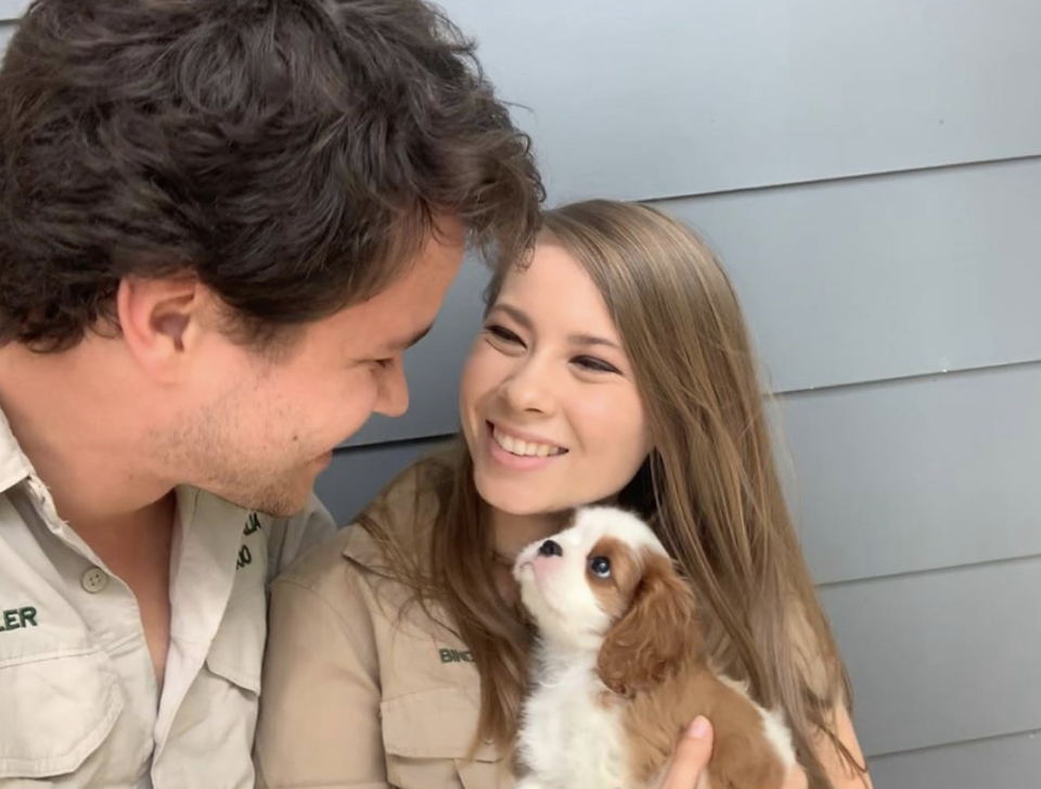 Bindi Irwin and Chandler Powell and their new puppy named Piggy.