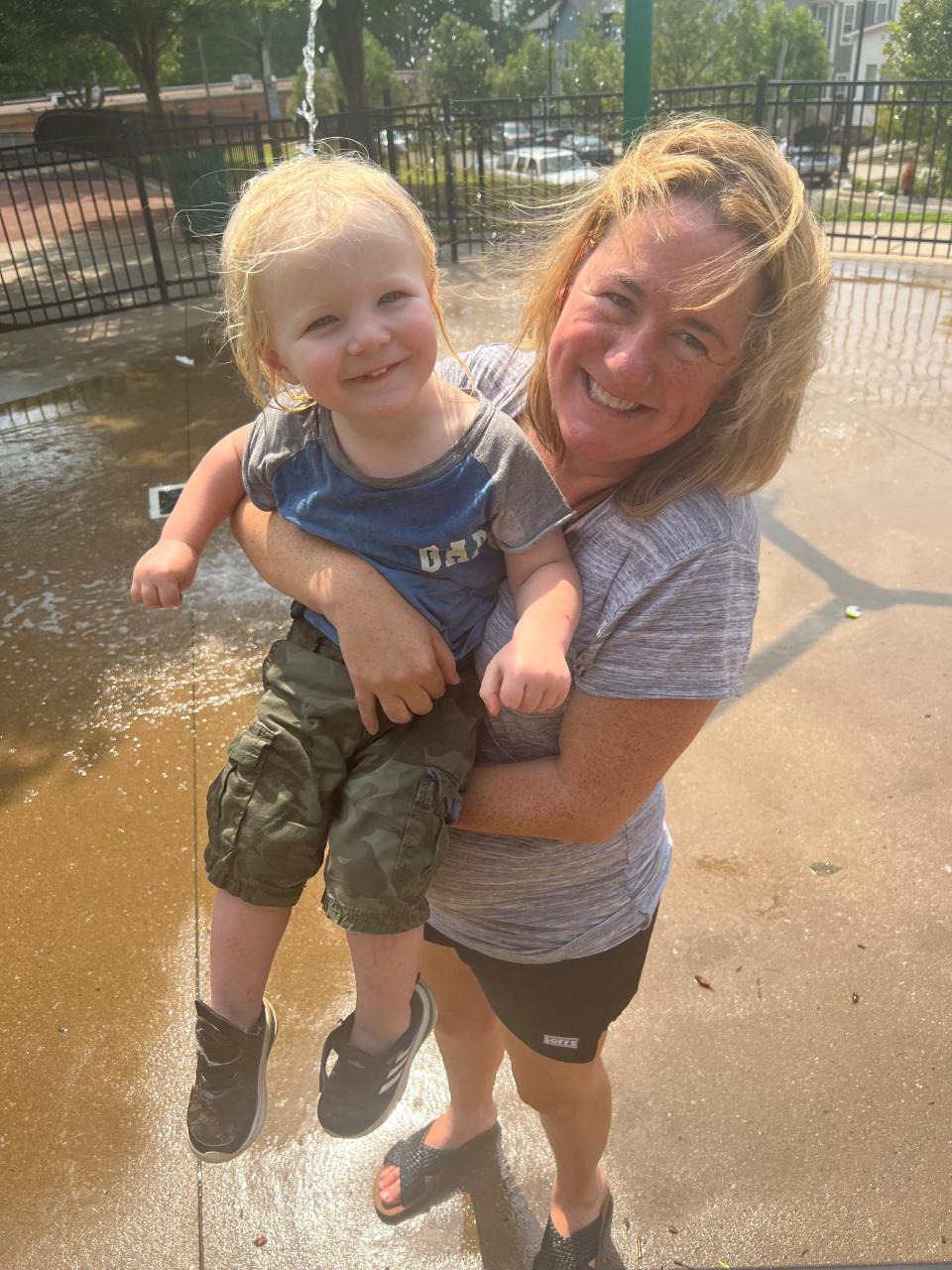 Julia Osgood enjoyes Kirkpatrick's splash pad with son Huck Miller.