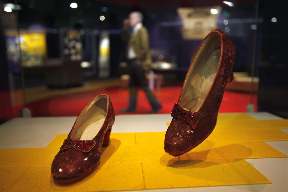 Dorothy's Ruby Slippers, from the "Wizard of Oz" are seen on display as part of a new exhibit, "American Stories," at the Smithsonian National Museum of American History in Washington, Wednesday, April 11, 2012. The National Museum of American History will open a new exhibit featuring iconic objects from pop culture along with objects dating back to the Pilgrims' arrival in 1620. "American Stories" will be a new chronology of U.S. history from the first encounters of Europeans and Native Americans to the 2008 presidential election. (AP Photo/Jacquelyn Martin)