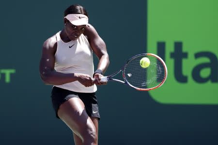 Mar 29, 2018; Key Biscayne, FL, USA; Sloane Stephens of the United States hits a backhand against Victoria Azarenka of Belarus (not pictured) in a women's singles semi-final of the Miami Open at Tennis Center at Crandon Park. Mandatory Credit: Geoff Burke-USA TODAY Sports