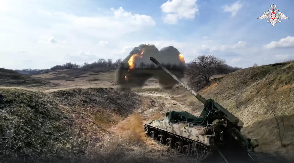 In this handout photo released by Russian Defense Ministry Press Service on Thursday, May 18, 2023, A Russian 152 mm self-propelled gun Giatsint-S fires toward Ukrainian positions at an undisclosed location. (Russian Defense Ministry Press Service via AP)