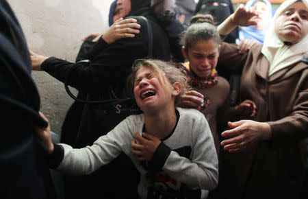 FILE PHOTO: A relative of Palestinian teenager Yousif al-Dayyah, 15, who was killed at the Israel-Gaza border fence during a protest on Friday, mourns during his funeral in Gaza City February 23, 2019. REUTERS/Suhaib Salem/File Photo