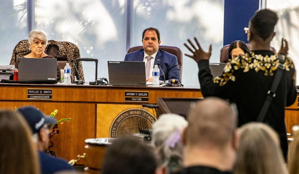 City of North Miami Beach Mayor Anthony F. DeFillipo, flanked by Commissioners Phyllis Smith, far left, and Fortuna Smukler, listens as a resident speaks at the City chambers as they discussed the hiring of a new city attorney. It was the first meeting that all commissioners attended since a judge ordered them to do so, on Tuesday, March 21, 2023.