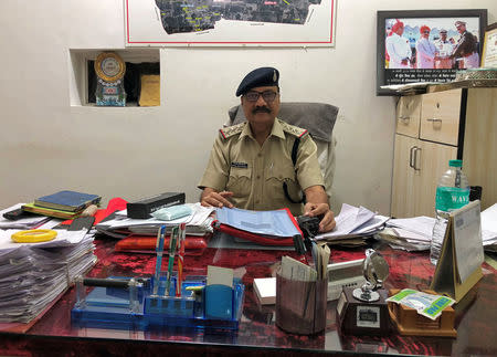 Shivpal Singh Kushwah, the police official who arrested Naveen Gadke, 26, poses inside his office in Indore, Madhya Pradesh, India, May 15, 2018. REUTERS/Krishna N. Das