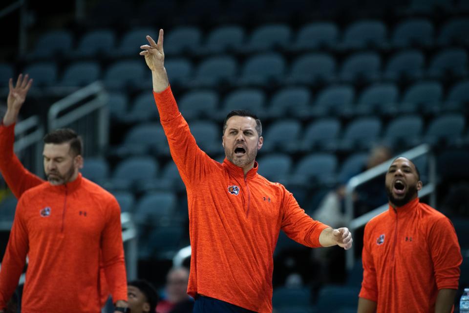 UT-Martin Head Coach Ryan Ridder yells and signals to the Skyhawks on the court during the second half of their game against the Southern Illinois University Edwardsville Cougars for the second round of the Ohio Valley Conference at Ford Center in Evansville, Ind., Wednesday night, March 2, 2023.