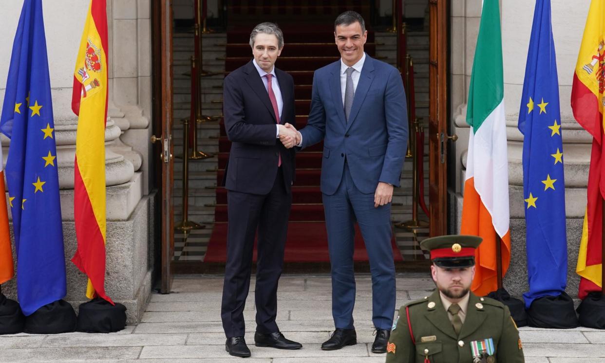 <span>Taoiseach Simon Harris (left) shakes hands with the Spanish prime minister, Pedro Sánchez, in Dublin.</span><span>Photograph: Brian Lawless/PA</span>