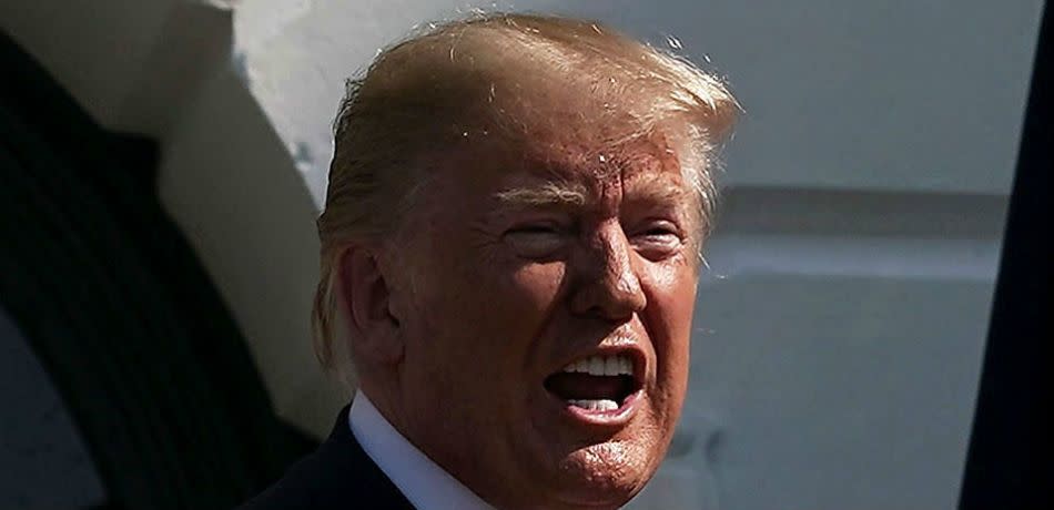 President Donald Trump speaks at the South Lawn of the White House in Washington.