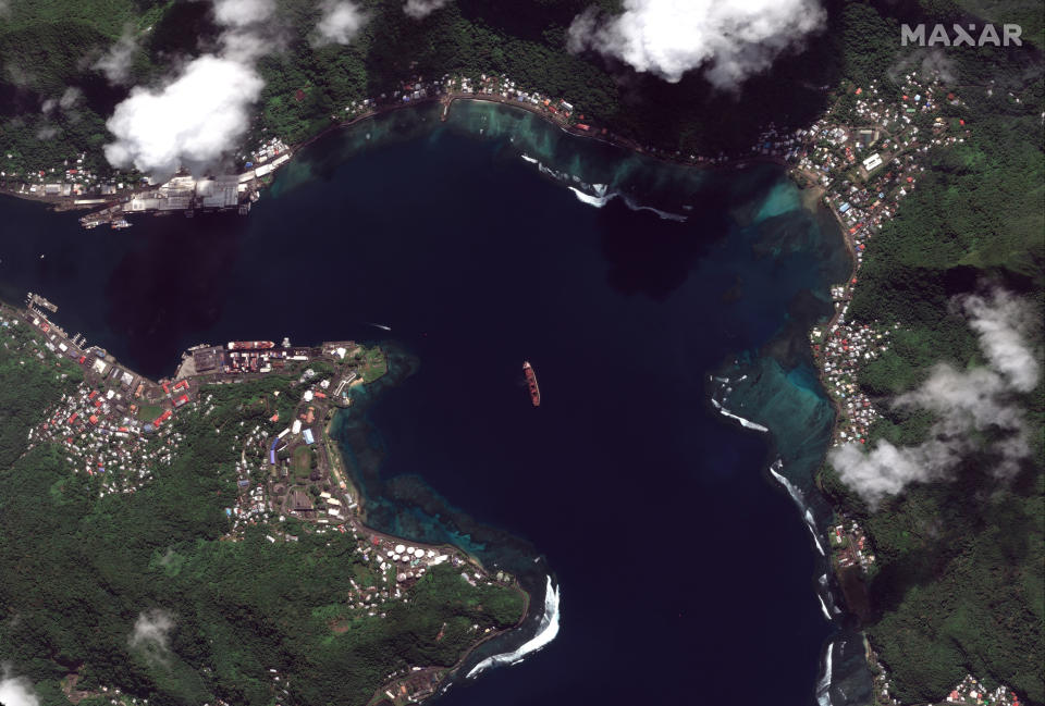 This Sunday, May 19, 2019 satellite image provided by Maxar Technologies shows the North Korean cargo ship "Wise Honest," center, in Pago Pago, American Samoa. North Korea's U.N. ambassador says the Trump administration should consider the possible consequences its seizing of the North Korean cargo ship could have on relations between the two countries and immediately return the vessel. The vessel was first detained in April 2018 by Indonesia while transporting a large amount of coal. The U.S. announced May 9, 2019, that it had seized the ship because it was carrying coal in violation of U.N. sanctions, a first-of-its kind enforcement action that came amid a tense moment in relations with North Korea. (Satellite image ©2019 Maxar Technologies via AP)