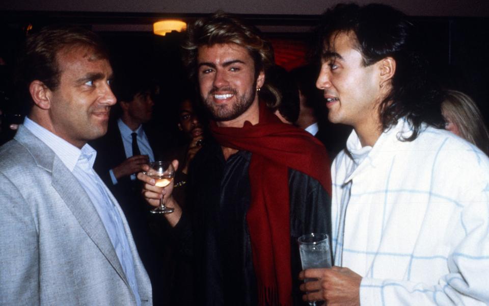 Simon Napier-Bell, pictured with George Michael and Andrew Ridgeley at the Ivor Novello Awards in 1985 - Alan Davidson/Shutterstock