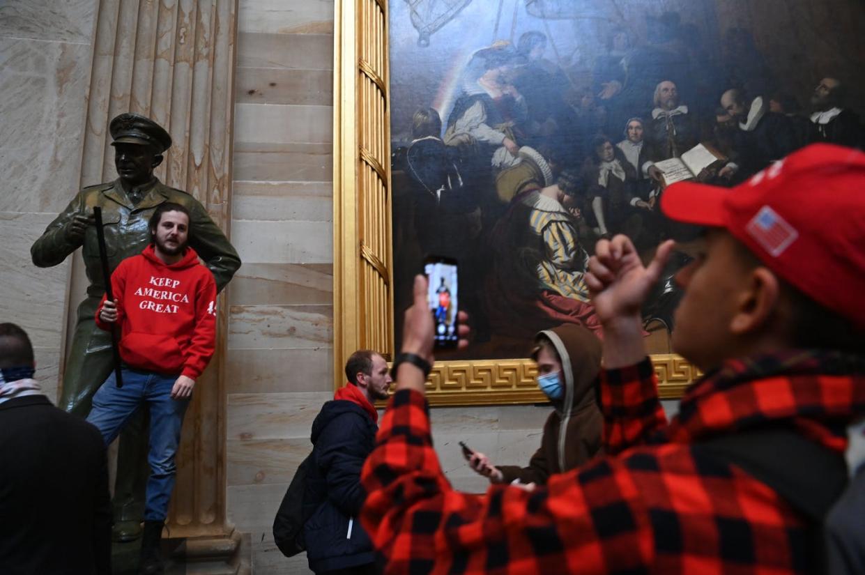 <span class="caption">Many of the people who broke into the U.S. Capitol building on Jan. 6 carried cellphones, which can be tracked, and posted photos of their activities on social media.</span> <span class="attribution"><a class="link " href="https://www.gettyimages.com/detail/news-photo/supporters-of-us-president-donald-trump-enter-the-us-news-photo/1230453071?adppopup=true" rel="nofollow noopener" target="_blank" data-ylk="slk:Photo by Saul Loeb/AFP via Getty Images;elm:context_link;itc:0;sec:content-canvas">Photo by Saul Loeb/AFP via Getty Images</a></span>