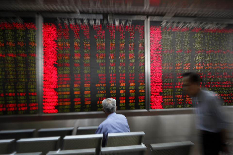 Investor monitor stock prices at a brokerage house in Beijing, Wednesday, May 22, 2019. Shares edged in Asia on Wednesday after a rebound in technology stocks helped power an overnight rally on Wall Street. (AP Photo/Andy Wong)