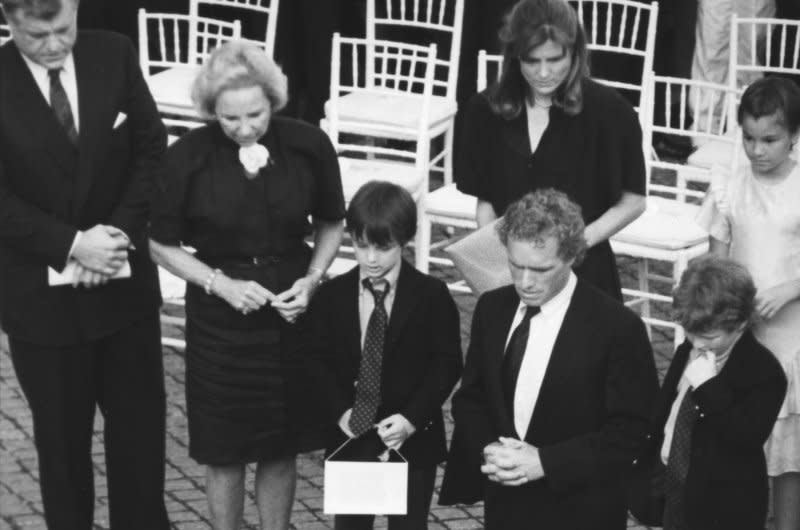 Sen. Edward Kennedy (far L), Ethel Kennedy (L), widow of Robert Kennedy, Rep. Joe Kennedy and other family members pay their respects at the grave of Robert F. Kennedy on June 6, 1988. UPI File Photo