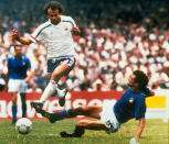 FILE - In this file photo dated June 17, 1986, Michel Platini, left, of France dribbles past Italian forward Alessandro Altobelli in their World Cup eight finals in Mexico City's Azteca Stadium. France won 2-0 to advance to the quarterfinals of the tournament and Italy was eliminated. Affectionately nicknamed “Le Roi” (The King), Michel Platini bestrode the soccer field with inimitable elegance as the world’s best player of the early 1980s, but his lofty reputation seems to have been tainted. (AP Photo, FILE)