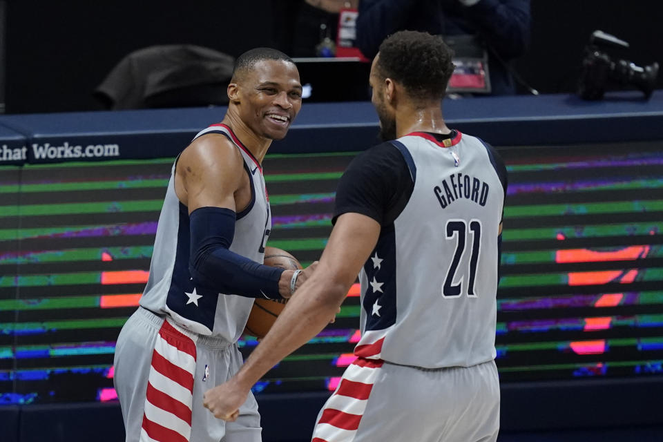 Washington Wizards' Russell Westbrook, left, celebrates with Daniel Gafford following an NBA basketball game against the Indiana Pacers, Saturday, May 8, 2021, in Indianapolis. Washington won 133-132 in overtime. (AP Photo/Darron Cummings)
