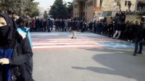 Social media image shows students walking around, instead of across, U.S. and Israeli flags at the Shahid Beheshti University in Tehran