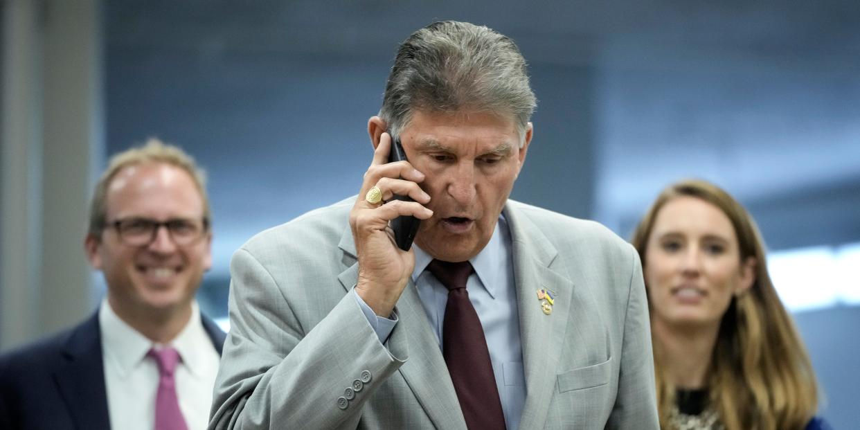 Joe Manchin on phone, capitol hill