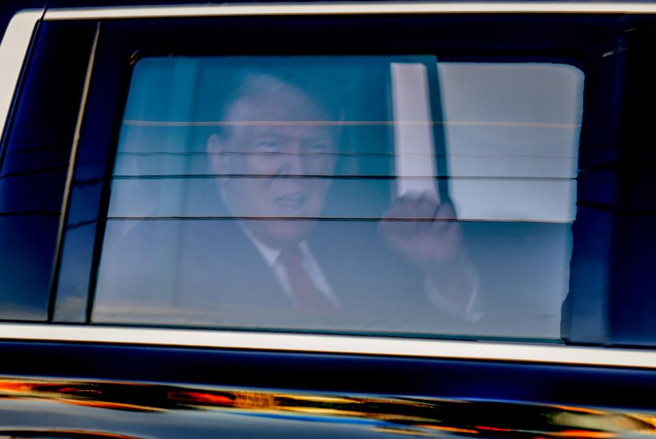 A motorcade passes by Trump supporters as former President Donald Trump arrives at the Alto Lee Adams, Sr. United States Courthouse on Thursday, March 14, 2024, in Fort Pierce.