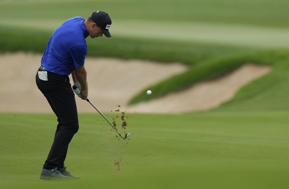 Victor Perez of France plays a shot on the 10th hole during the first round of the Abu Dhabi Championship golf tournament at the Yas Links Golf Course in Abu Dhabi, United Arab Emirates, Thursday, Jan. 20, 2022. (AP Photo/Kamran Jebreili)