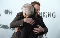 Jason Segel, rear, co-creator/co-writer/executive producer/cast member in "Shrinking," embraces cast member Harrison Ford at the premiere of the Apple TV+ series, Thursday, Jan. 26, 2023, at the Directors Guild of America in Los Angeles. (AP Photo/Chris Pizzello)