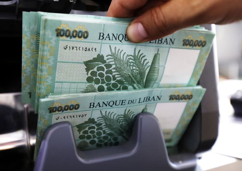 FILE PHOTO: Lebanese pound banknotes are seen at a currency exchange shop in Beirut