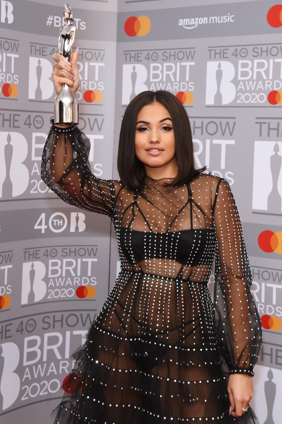 LONDON, ENGLAND - FEBRUARY 18: (EDITORIAL USE ONLY)  Mabel, winner of the Female Solo Artist award, poses in the winners room at The BRIT Awards 2020 at The O2 Arena on February 18, 2020 in London, England.  (Photo by David M. Benett/Dave Benett/Getty Images)