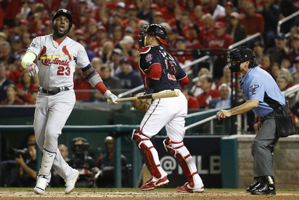 St. Louis Cardinals' Marcell Ozuna reacts after striking out during the second inning of Game 4 of the baseball National League Championship Series against the Washington Nationals Tuesday, Oct. 15, 2019, in Washington. (AP Photo/Patrick Semansky)