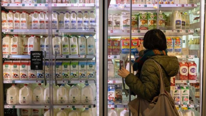 woman looking at milk