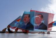 <p>Supporters of Turkey’s Prime Minister and presidential candidate Tayyip Erdogan wave flags in a boat on their way to an election rally in Istanbul August 3, 2014. (Murad Sezer/Reuters) </p>